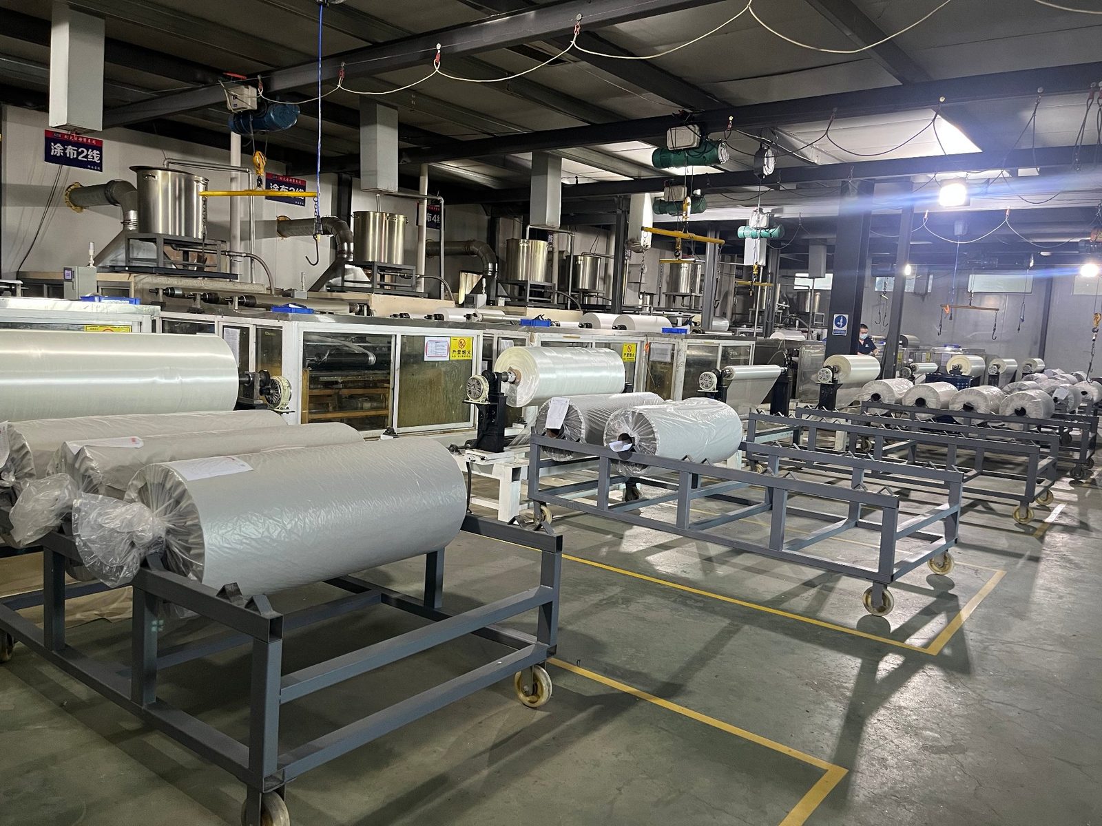 Mica board production hall with finished mica rolls